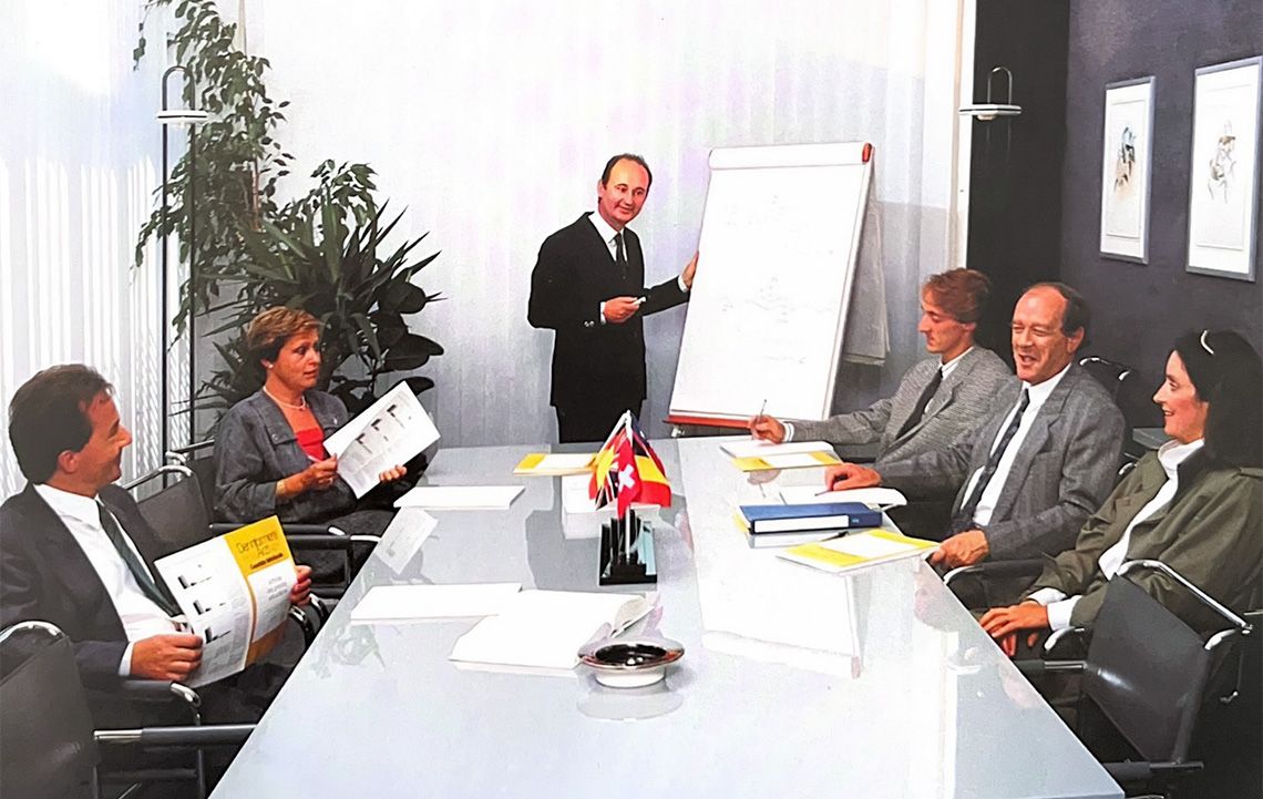 Stefano Rovati (sitting, on the left of the blackboard) during a company meeting in the Nineties